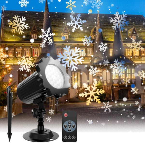 Christmas snowflake projection light complete set with ground stake base and wireless remote control, multi-colored snowflake patterns projected on retro European castle house exterior, decorated Christmas tree on side, winter holiday outdoor decorative lamp advertising render