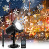 Christmas outdoor snowflake projection light set with ground stake and remote control, projecting multi-color snowflake patterns on colorful waterfront town buildings at night, festive holiday yard decorative lamp promotional image