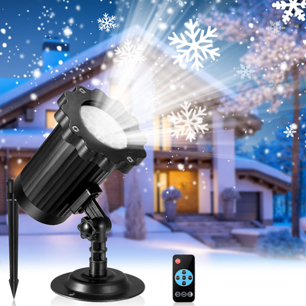 Snowflake projection light with detachable ground stake and wireless remote control, rotating white snowflake patterns projected on snow-covered modern villa at dusk, winter outdoor Christmas decorative lamp commercial product graphic
