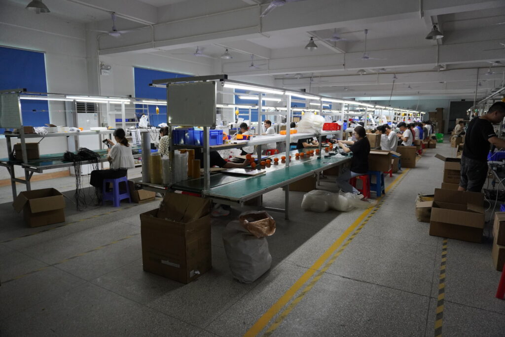 LED factory warehouse floor, storage area with carton packages and safety marking lines